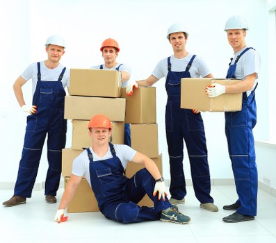 Local movers carrying household items in Harringay