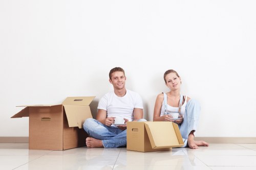 Professional movers handling furniture in Harringay home